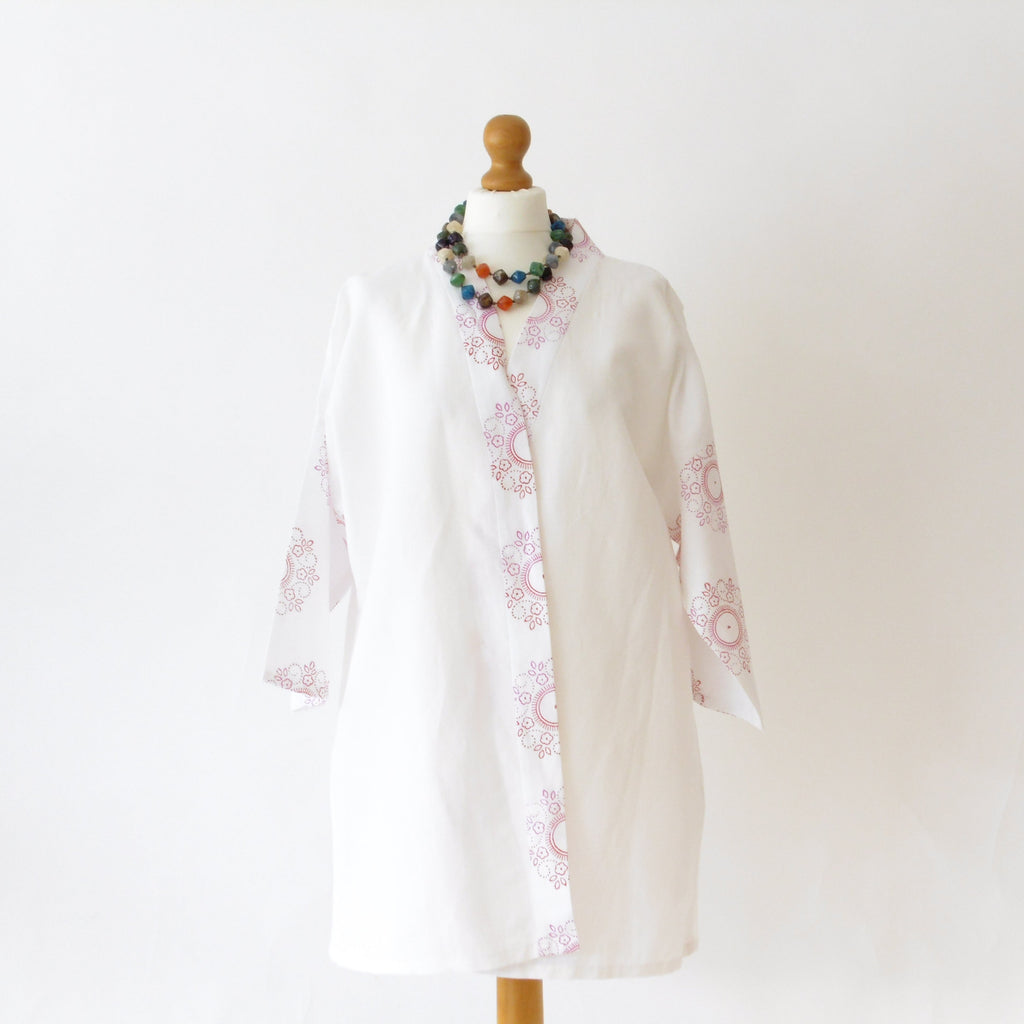 White linen hand block printed kimono jacket - front view on mannequin with colourful bead necklace