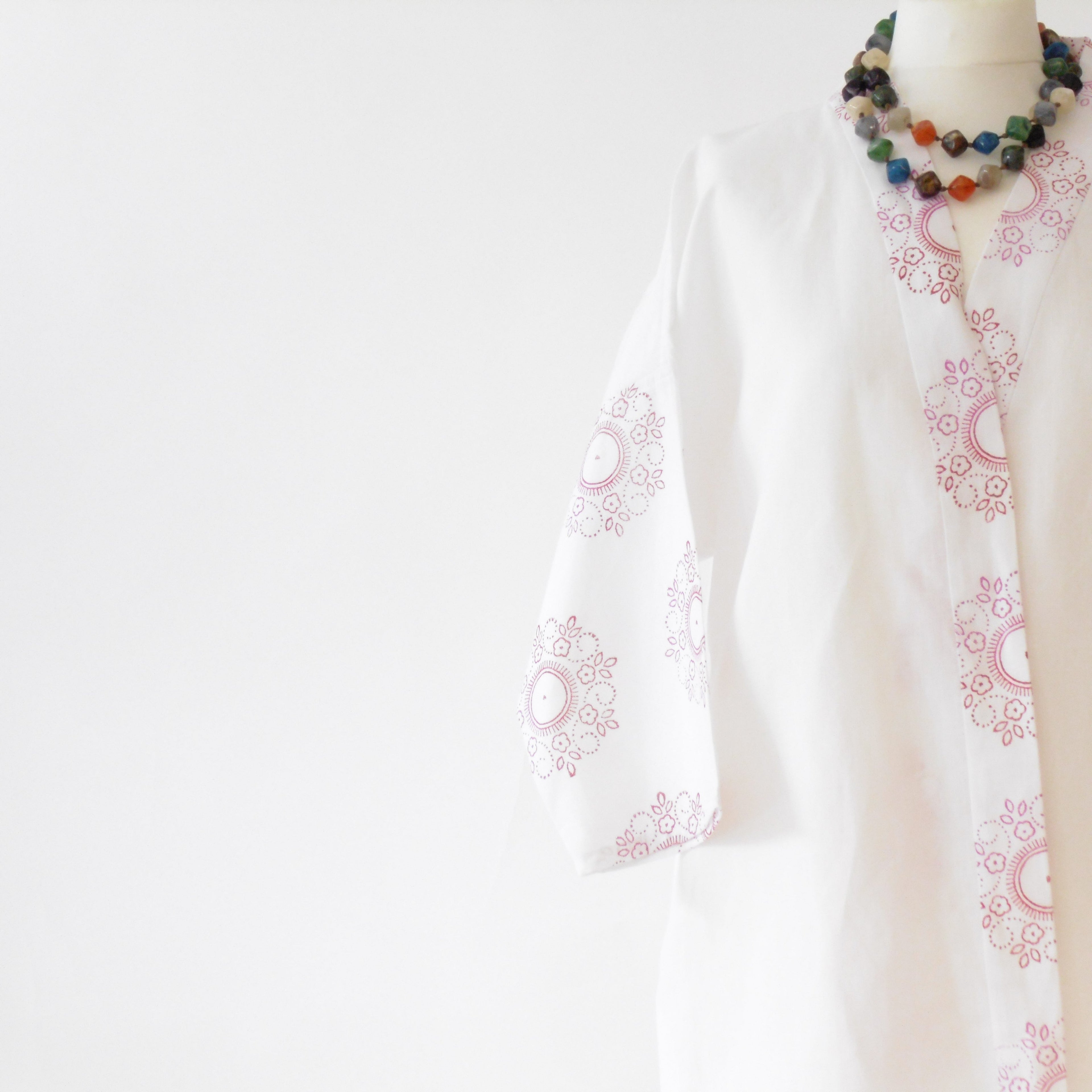 White linen kimono jacket sleeve and body detail with dainty floral mandala print