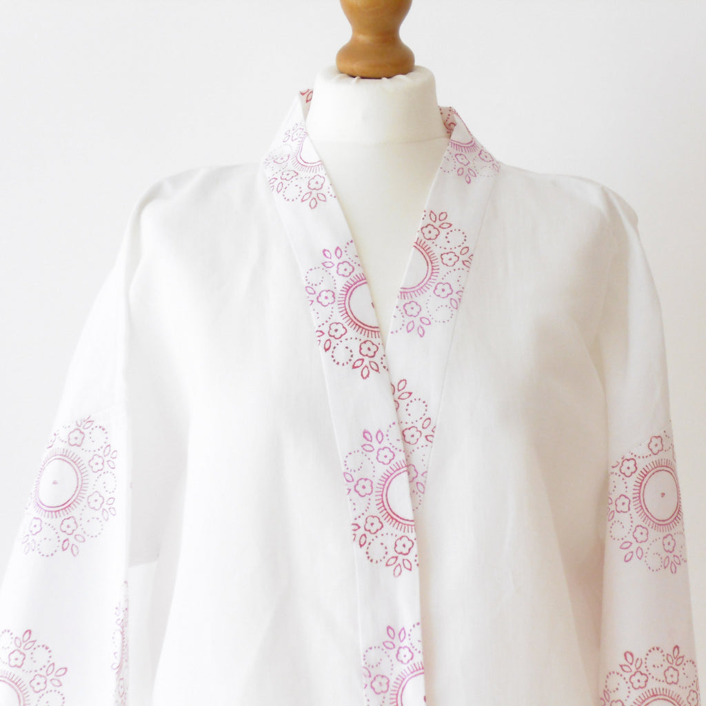 White linen kimono jacket close up of neckline and floral mandala block print