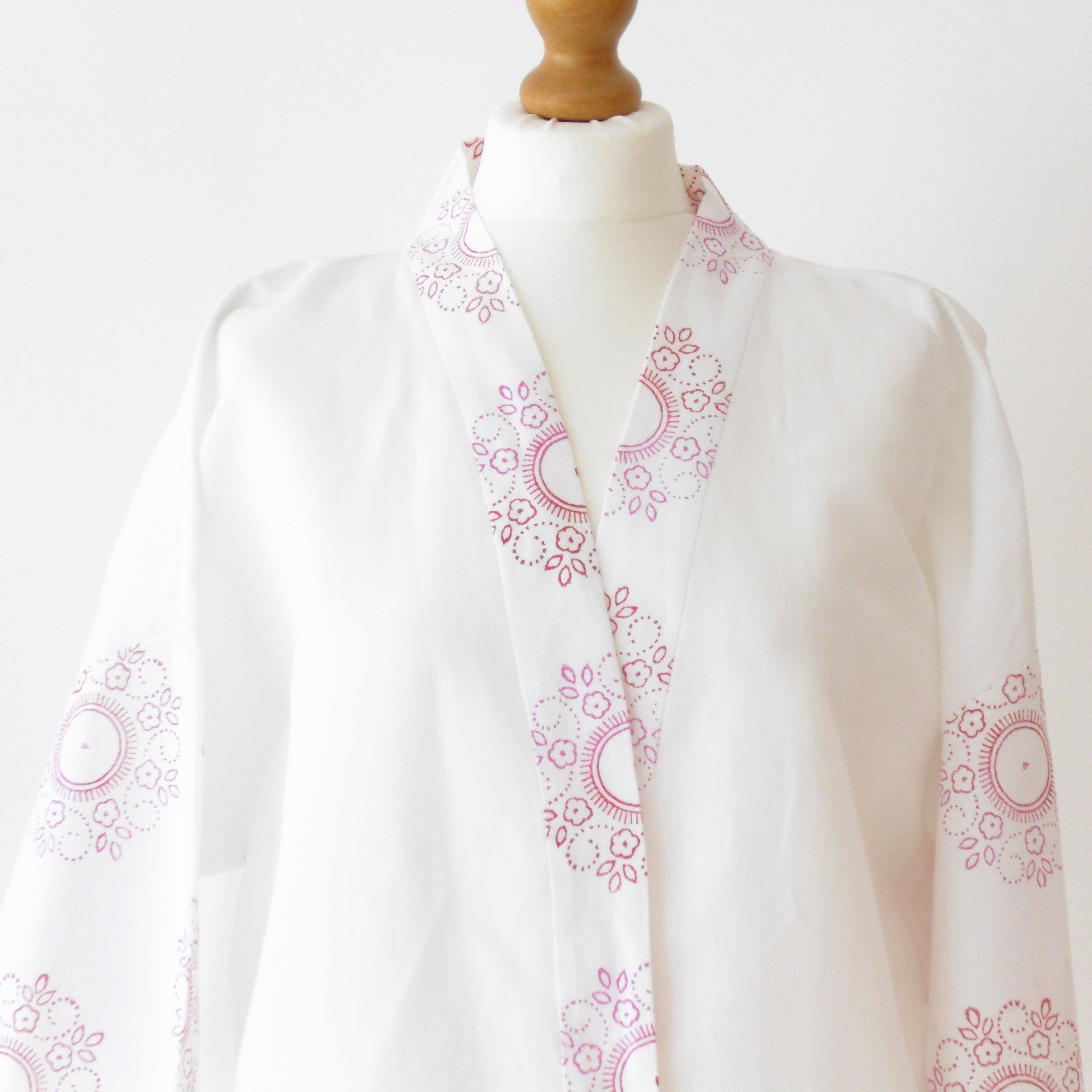 White linen kimono jacket close up of neckline and floral mandala block print