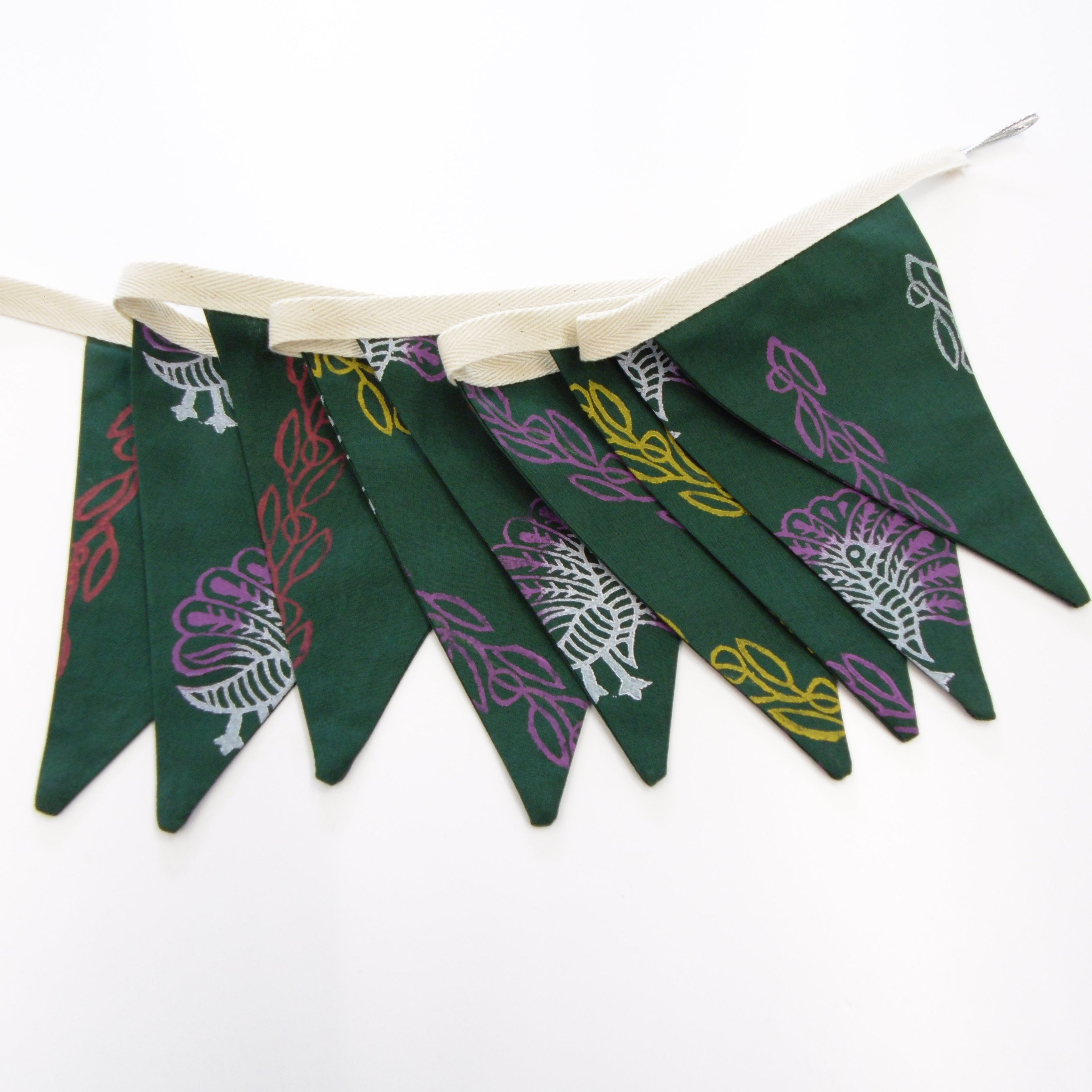 Hand block printed green cotton bunting with multicoloured peacock and vine design, 9 flags