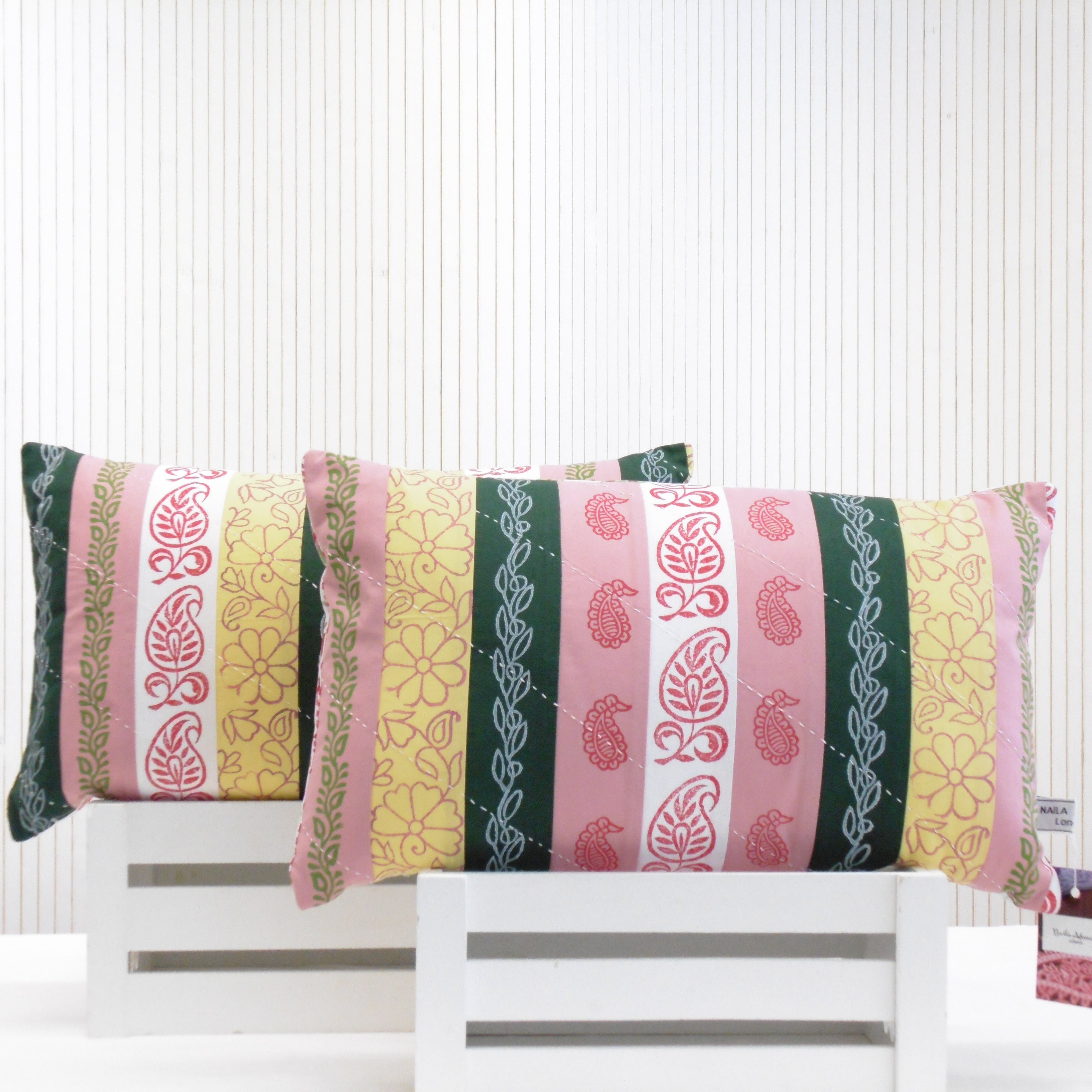 Hand block printed oblong patchwork cushions in pink yellow and green stripes with paisley and floral block prints, fully lined and top stitched, Jashn by Naila Ahmad London