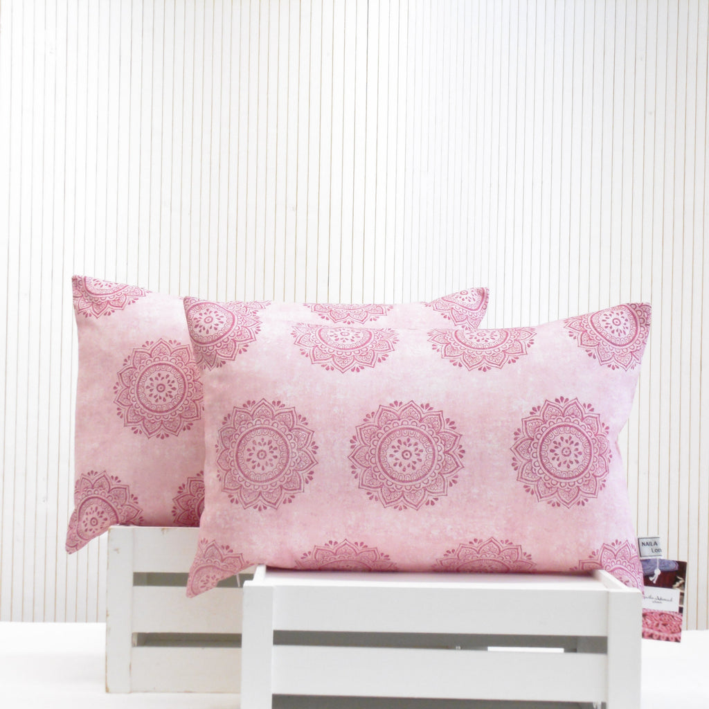 Pair of hand block printed pink mandala oblong cushions, part of the Gulabi Aangan home set by Naila Ahmad London