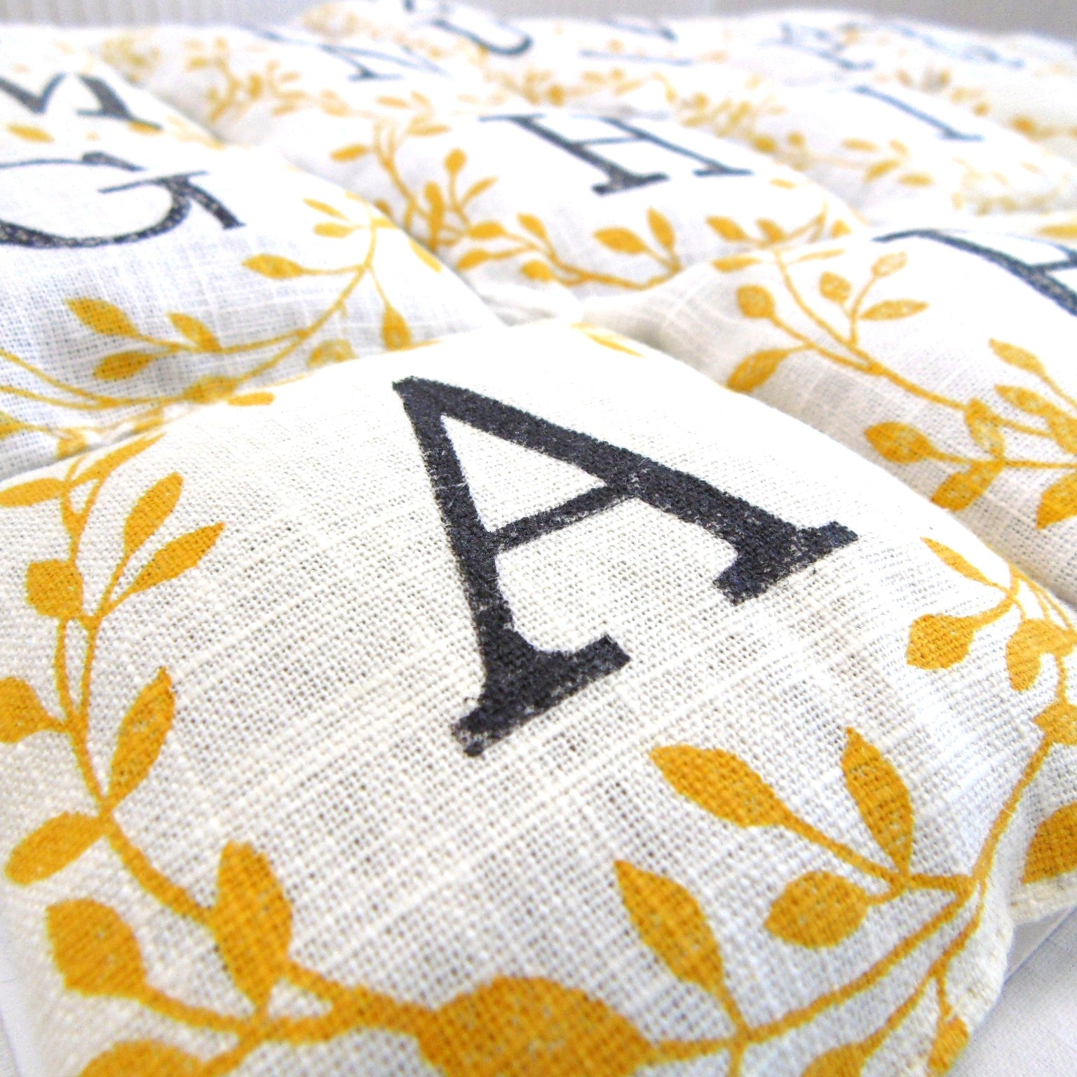 Hand block printed lavender sachet with letter A and golden leaf design, filled with dried lavender, by Naila Ahmad London