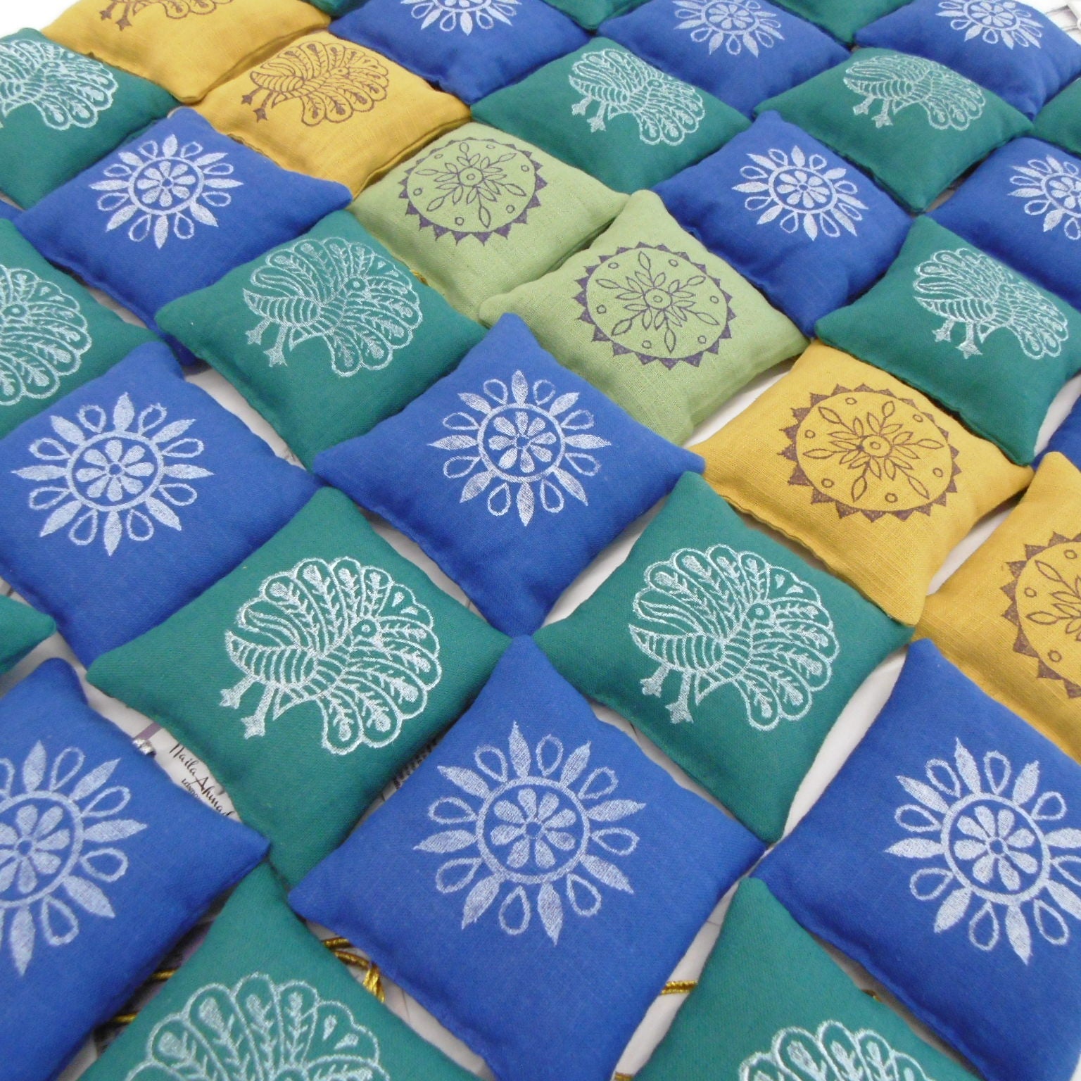 Hand block printed lavender sachets in cobalt blue teal and yellow with peacock and mandala designs, Rang Bazaar by Naila Ahmad London