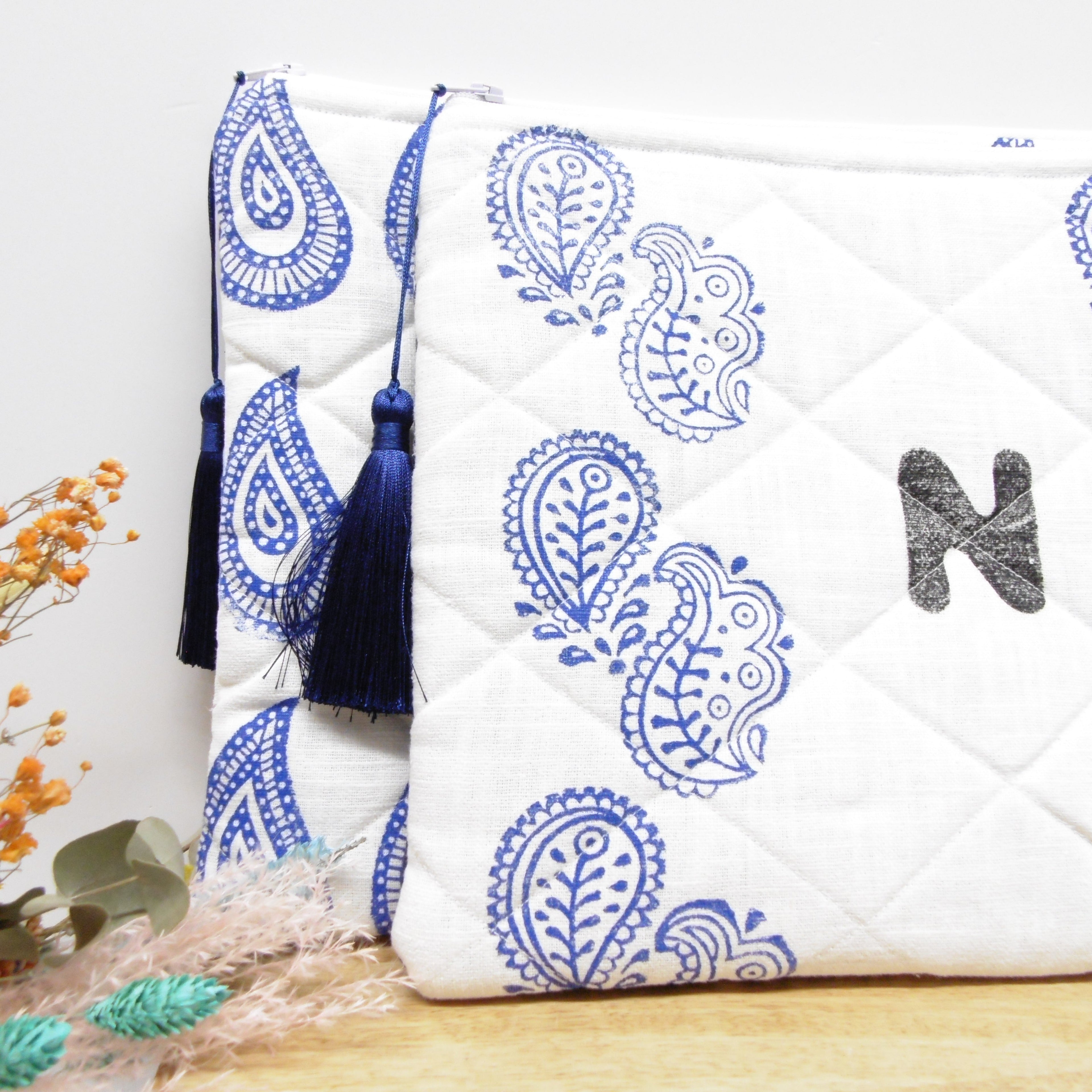 Quilted hand block printed pouches with blue paisley print and navy tassel