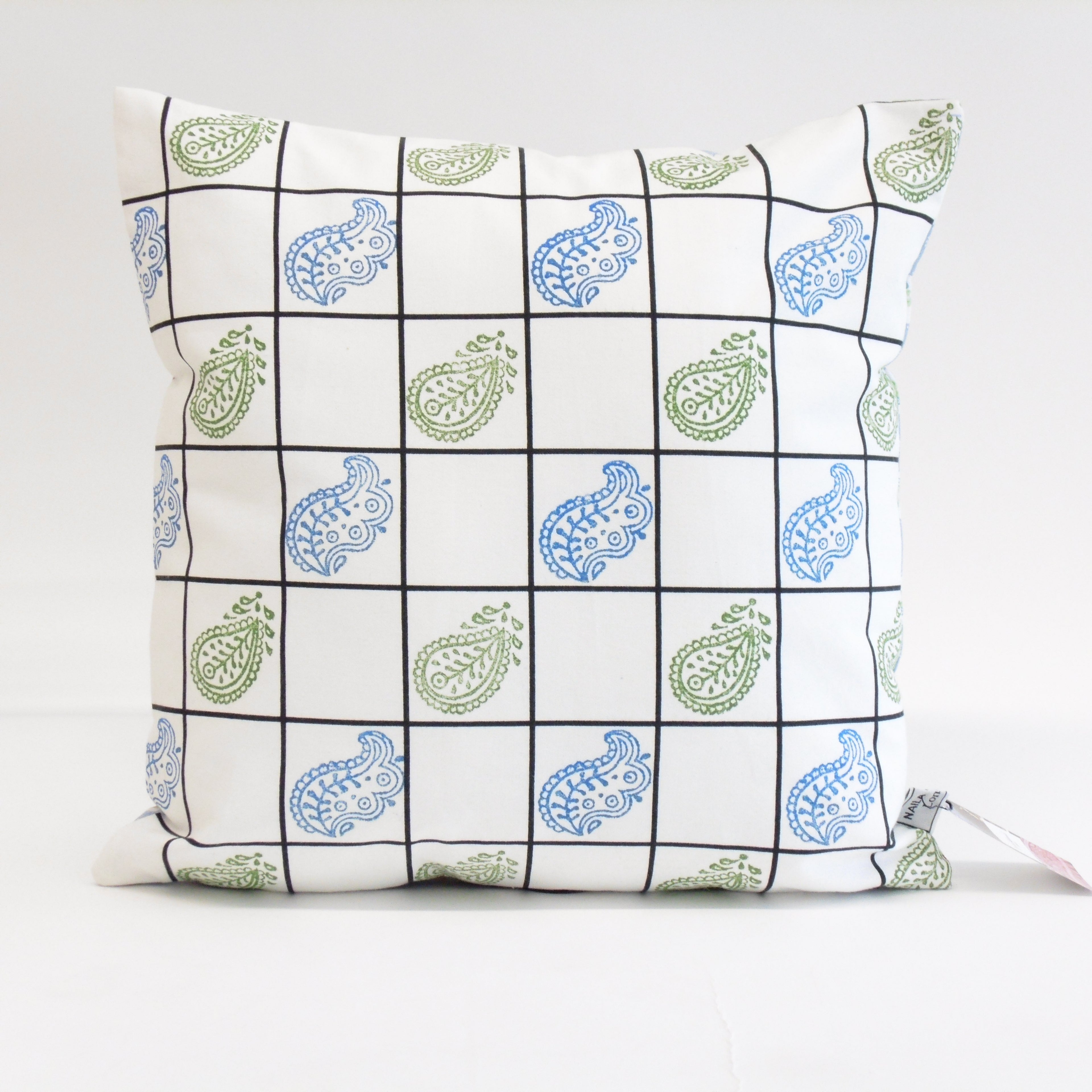 Decorative pillow with paisley pattern on a white background
