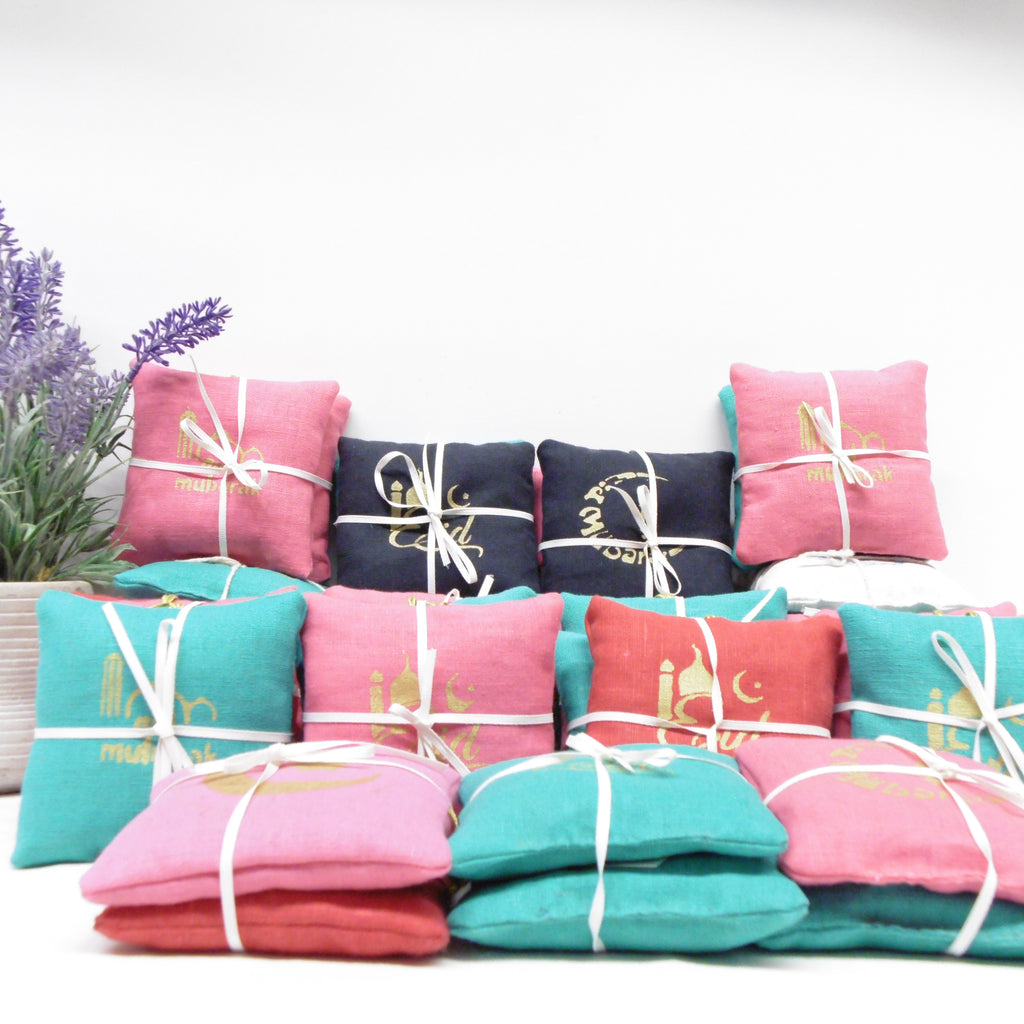 Colorful folded clothes tied with white ribbons on a white background