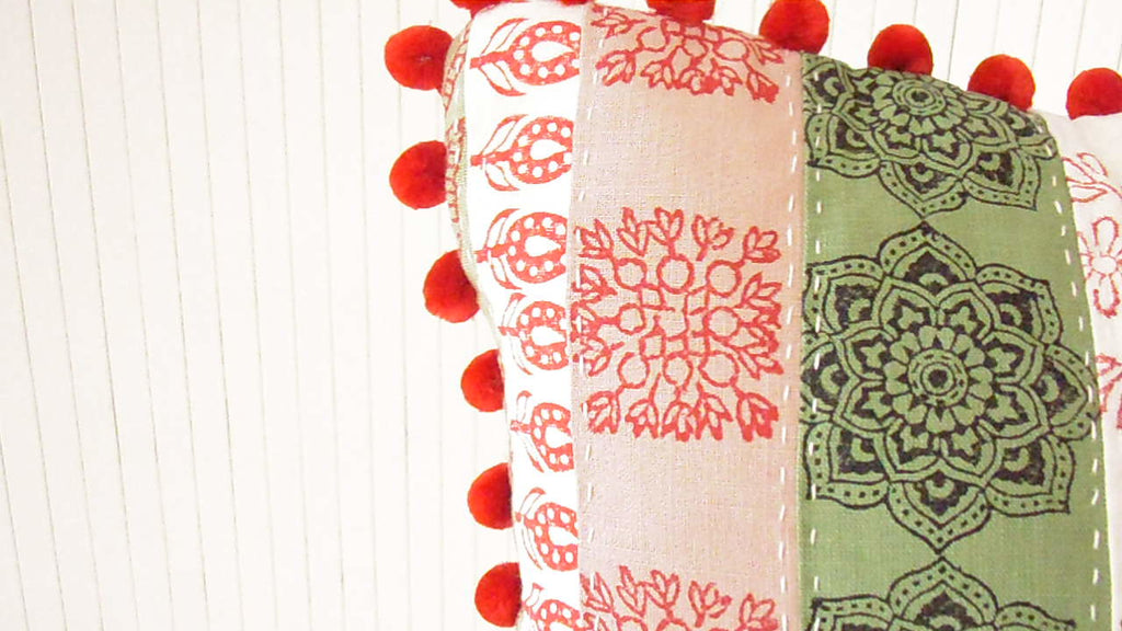 patchwork cushion hand printed in white red green and pink colors an dfabrics