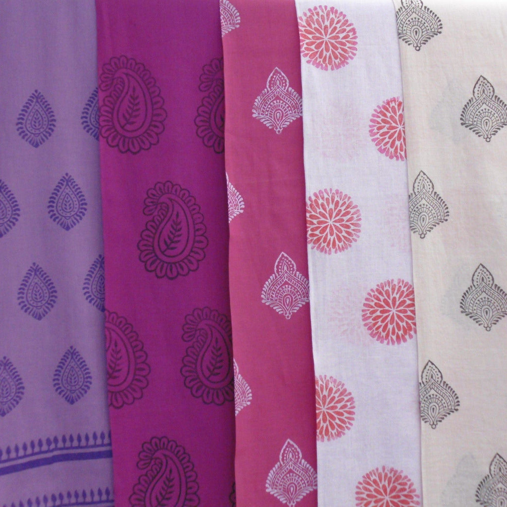 Set of five fabric swatches with different patterns and colors.