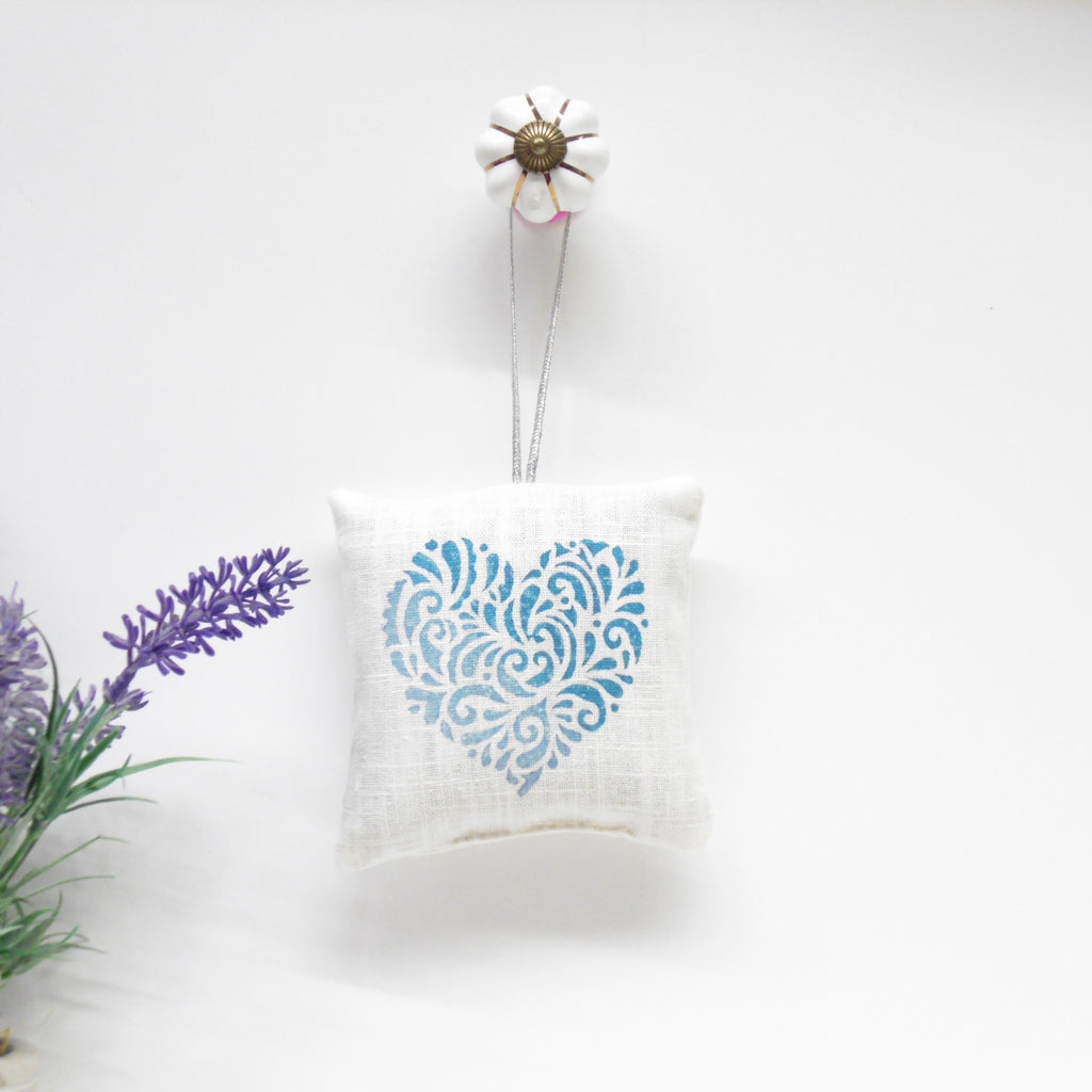 Decorative pillow with floral design on a white background