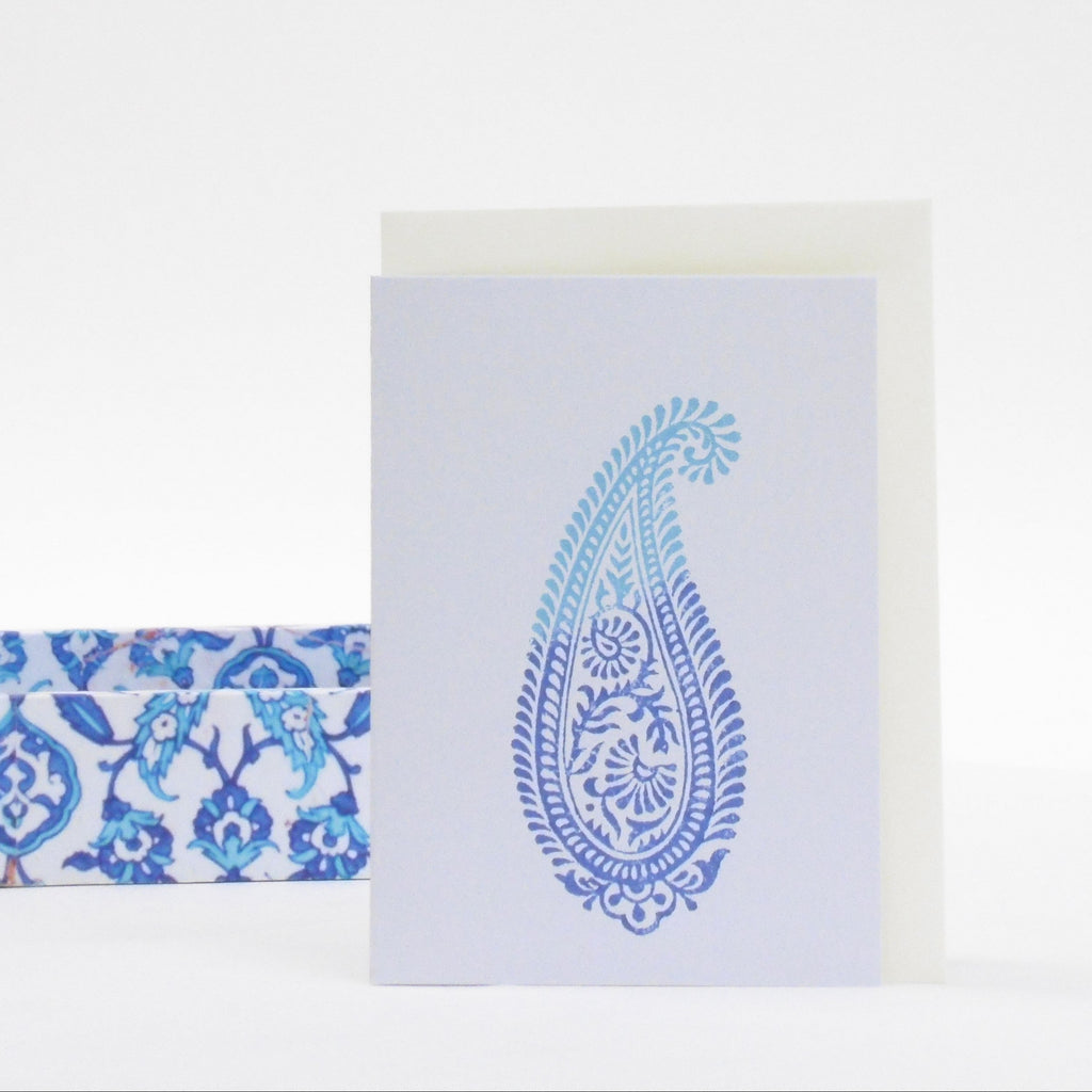 Card with blue paisley design on a white background