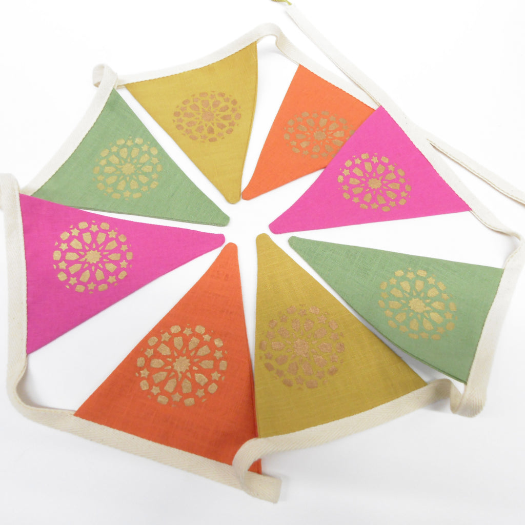 Colorful triangle-shaped bunting flags with decorative patterns on a white background