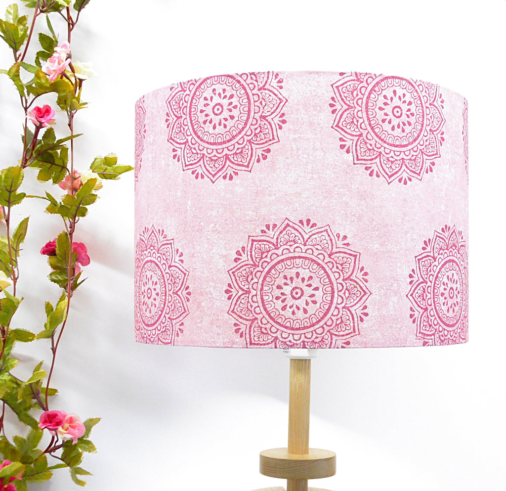 Lamp with pink mandala pattern on a white background