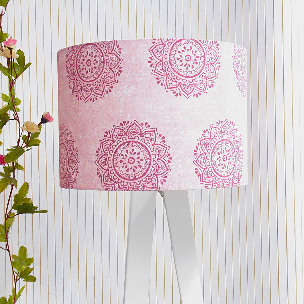 Lampshade with pink mandala pattern on a white background