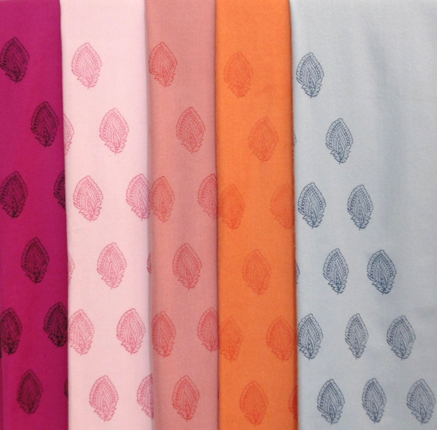 Five fabric swatches with leaf patterns in various colors.