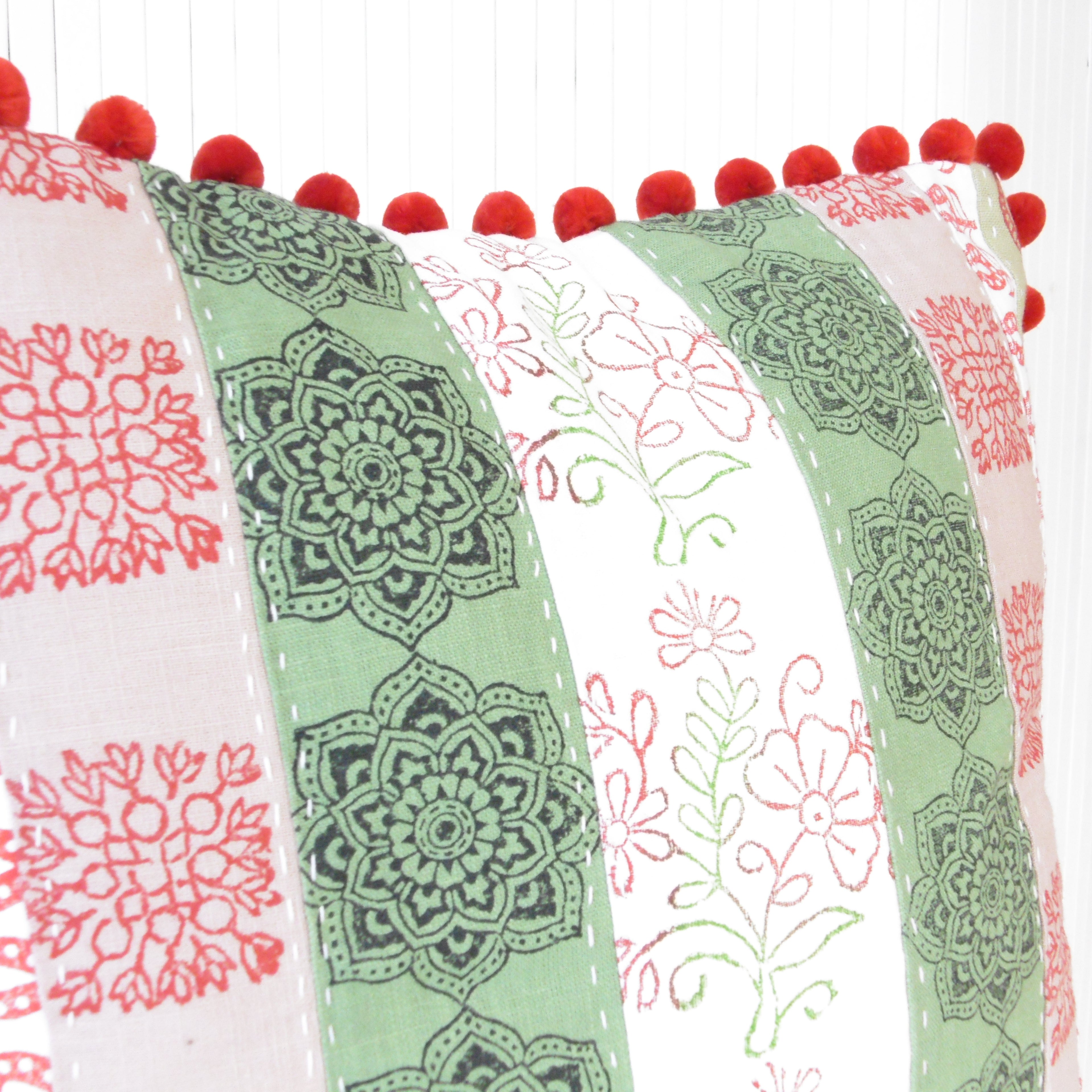red green white pink block printed patchwork cushion